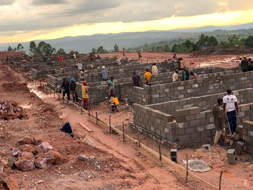 Construction workers building modern infrastructure in Africa with cranes